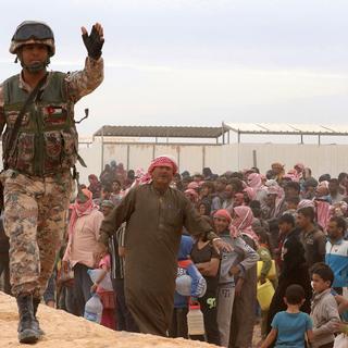 Quelque 100'000 Syriens sont bloqués en plein désert a la frontière jordanienne (image d'illustration). [AFP - Khalil Mazrawwi]
