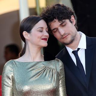 Marion Cotillard et Louis Garrel montaient les marches du Festival de Cannes, ce dimanche soir, pour le film "Mal de Pierres". [AFP - Valery Hache]