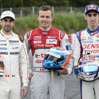 Les pilotes suisses Neel Jani (Porsche), gauche, Marcel Faessler (Audi), centre, et Sebastien Buemi (Toyota), droite, le 26 mai 2015. [Keystone - Jean-Christophe Bott]