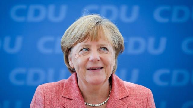 Angela Merkel est candidate à un quatrième mandat de chancelière, ainsi qu'à la présidence de son parti conservateur, la CDU. [Keystone - EPA/Kay Nietfeld]