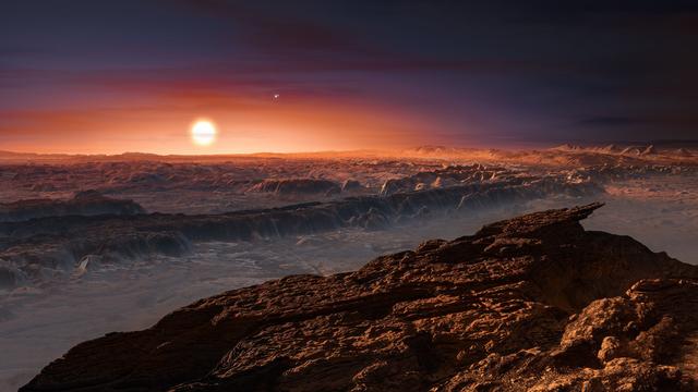 Vue d'artiste de la surface de Proxima b, tournant autour de la naine rouge Proxima Centauri, l'étoile la plus proche du système solaire. [keystone - European Southern Observatory]