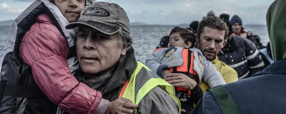 Des migrants arrivent sur l'île de Lesbos, en Grèce, le 13 janvier dernier. [NurPhoto/AFP - Artur Widak]