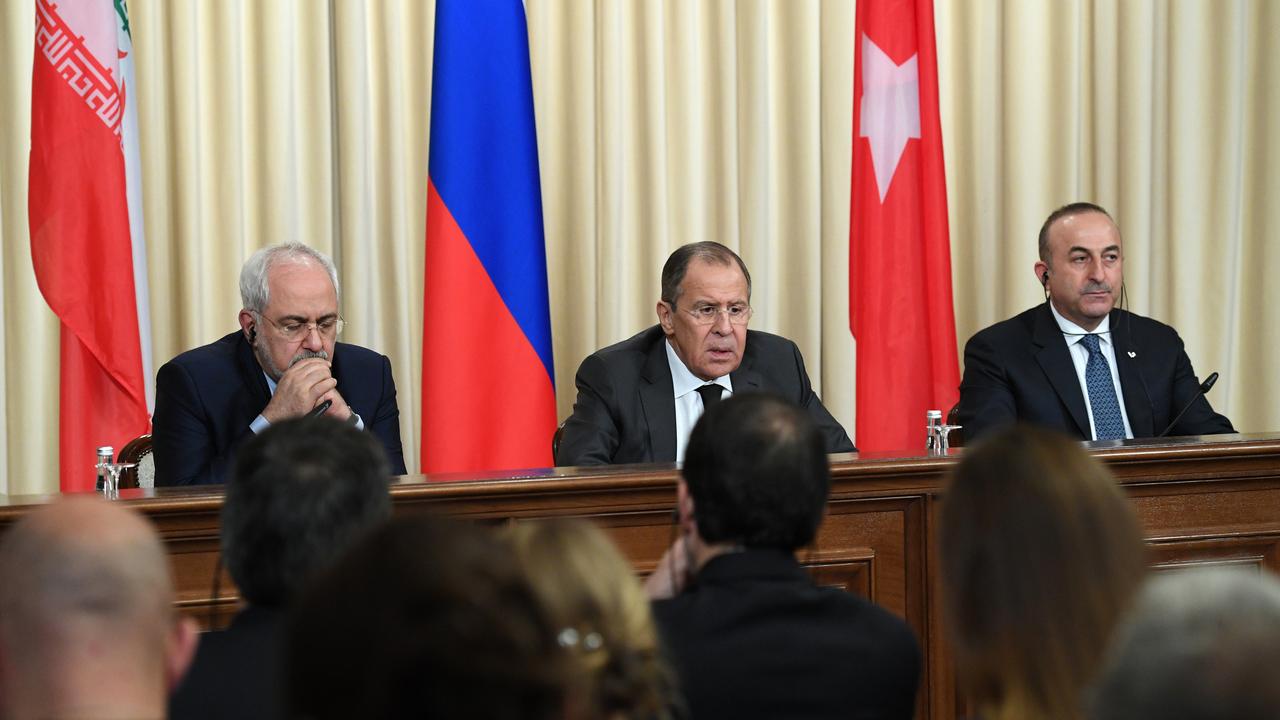 Les ministres des Affaires étrangères iranien, russe et turcs ont adopté une déclaration dans l'optique de mettre fin au conflit syrien. [AFP - Natalia Kolesnikova]