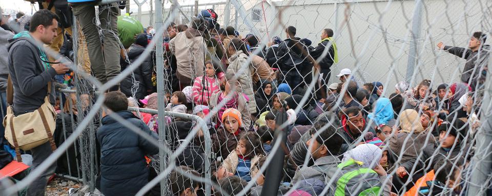 Des migrants dans la ville grecque d'Idomeni. [AFP - Besar Ademi - Anadolu Agency]