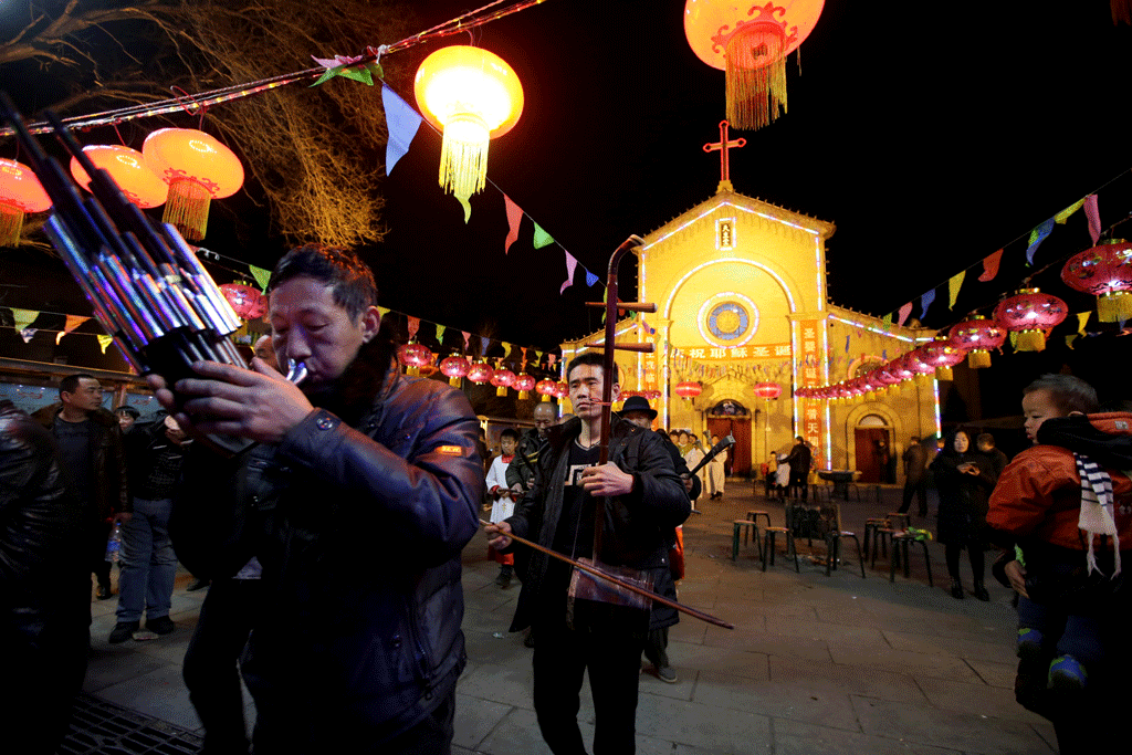 Des catholiques chinois à la veille de Noël. [Reuters - Jason Lee]