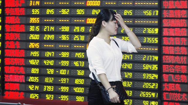 Les marchés financiers chinois ont ouvert vendredi matin sans filet de sécurité. [EPA/Keystone - Woo He]
