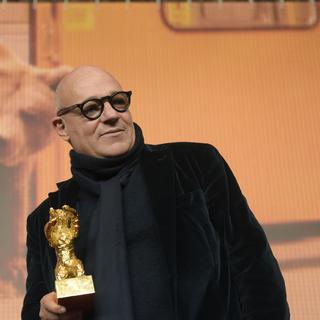 Le réalisateur Gianfranco Rosi a remporté l’Ours d’Or lors de la 66e Berlinale pour son film "Fuocoammare". [AFP - Odd Andersen]