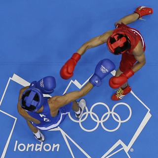 Jusqu'à présent, les boxeurs professionnels n'avaient pas le droit de combattre aux Jeux olympiques. [Keystone - Darron Cummings - AP Photo]