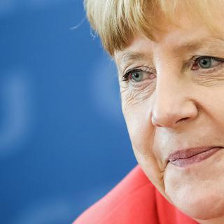 Angela Merkel pensive suite au revers que son parti, l'Union chrétienne démocrate, a connu aux dernières élections régionales [Keystone - MICHAEL KAPPELER]