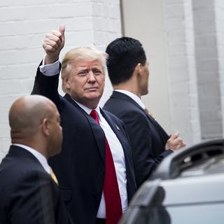 Donald Trump à son arrivée à la rencontre des dirigeants du parti républicain. [Brendan Smialowski / AFP]