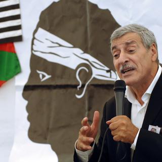 Ferhat Mehenni, president of the Kabylia Autonomy Movement (MAK), presenting his movement, in Corte, Corsica, on August 8, 2009. [AFP - STEPHAN AGOSTINI]