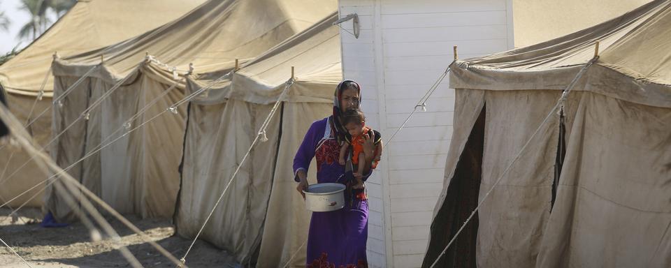 Une femme et son enfant dans le camp de Amriyat al Falloujah (image d'illustration). [Reuters - Ahmad Mousa]