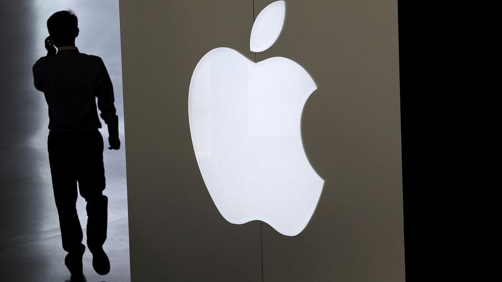 Apple a vendu moins d'iPhones que prévu l'an dernier. [AP/Keystone - Andy Wong]