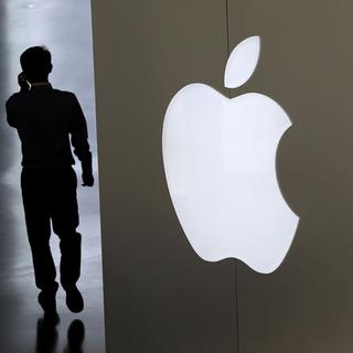 Apple a vendu moins d'iPhones que prévu l'an dernier. [AP/Keystone - Andy Wong]