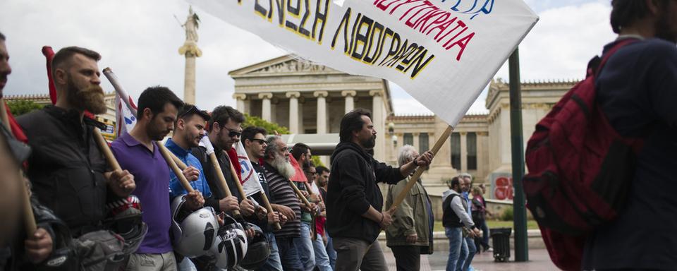 Les Grecs ont manifesté ce week-end dans les rues du pays. C'était la quatrième grève générale depuis le mois de septembre. [Keystone - Petros Giannakouris - AP Photo]