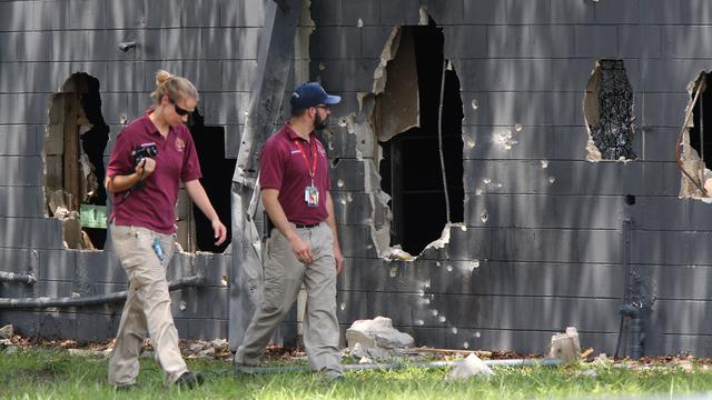 Des experts inspectent le lieu de la tuerie à Orlando. [The Tampa Bay Times via AP/Keystone - Doug Clifford]