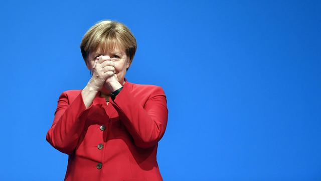 Angela Merkel devant le congrès de la CDU mardi à Essen. [AP/Keystone - Martin Meissner]