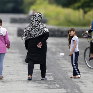 Quelque 300’000 enfants de migrants sont en âge d'être scolarisés en Allemagne. [AP/Keystone - Michael Probst]