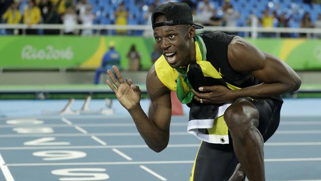 Usain Bolt rejoint Lewis et Nurmi dans la légende de l'athlétisme. [Matt Dunham]