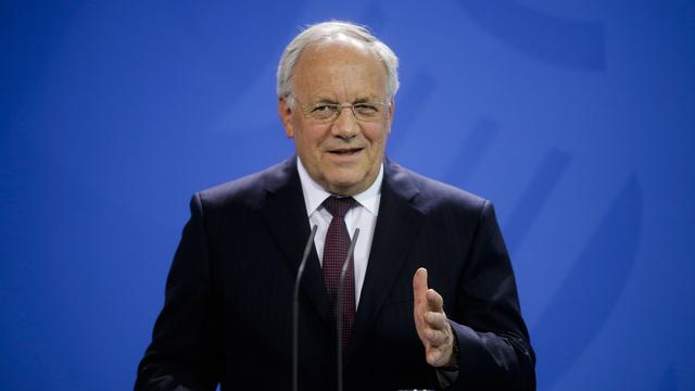 Le président de la Confédération Johann Schneider-Ammann lors d'une conférence de presse avec Angela Merkel à Berlin. [AP Photo/Keystone - Markus Schreiber]