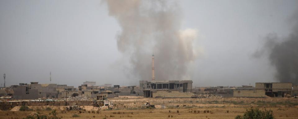 Vue des combats menés à Falloujah entre les forces gouvernementales et l'EI le 13 juin dernier. [Reuters - Thaier Al-Sudani]