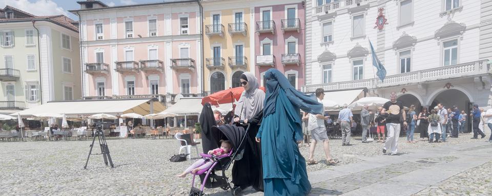 Une loi interdisant de se dissimuler le visage est déjà entrée en vigueur au Tessin. [KEYSTONE - Ti-Press/Pablo Gianinazzi]