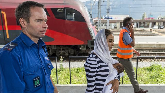 Des migrants à la gare de Buchs (SG). [key - Dominic Steinmann]