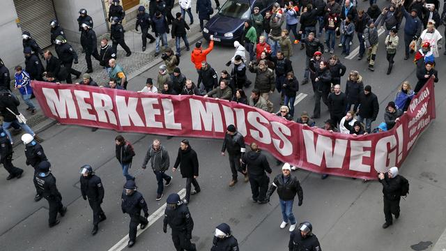 Des militants anti-migrants ont manifesté à Berlin, intimant à la chancelière allemande de démissionner. [Fabrizio Bensch]