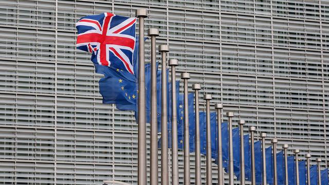 L'"Union Jack", le drapeau britannique, flotte aux côtés des drapeaux européens à Bruxelles, ce 29 janvier 2016, à l'occasion de la visite de David Cameron. [EPA/Keystone - Laurent Dubrule]