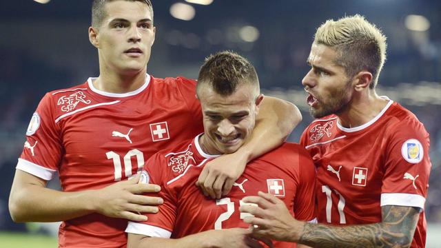 Granit Xhaka, Xherdan Shaqiri et Valon Behrami ont des racines kosovares. [Walter Bieri]