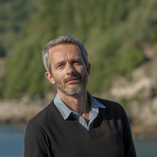 Le réalisateur français Jérôme Salle au Festival du film de San Sebastian. [AFP - Eli Gorostegi]