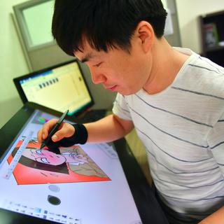 Choi Sung-Guk, réfugié venu de Corée du Nord, publie sa propre BD en ligne. [AFP - Jung Yeon-Je]