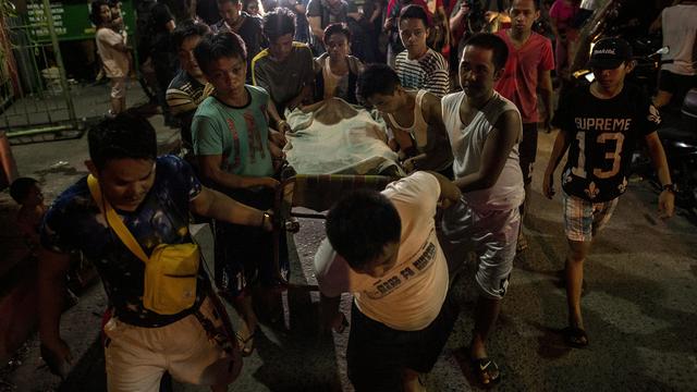 Dans les rues de Manille, chaque nuit, il pleut des cadavres. [AFP - Noel Celis]