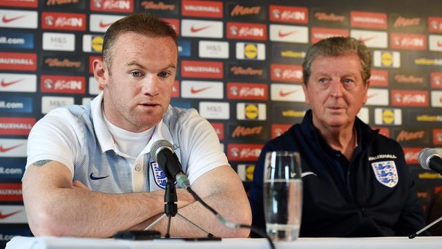 Wayne Rooney (à g.) et Roy Hodgson ont demandé aux fans anglais de bien se conduire. [A.Rain]