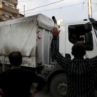 Des convois d'aide humanitaire arrivent en Syrie. [Reuters - Bassam Khabieh]