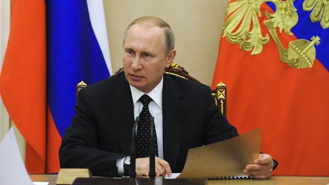 Londres, Berlin et Paris n’excluent pas de sanctionner plus encore la Russie de Vladimir Poutine. [AP/Keystone - Mikhail Klimentyev]