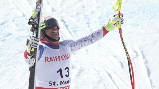 Beat Feuz jubile après la descente des Mondiaux de St-Moritz, qui lui a offert une médaille d'or. [Alexandra Wey]