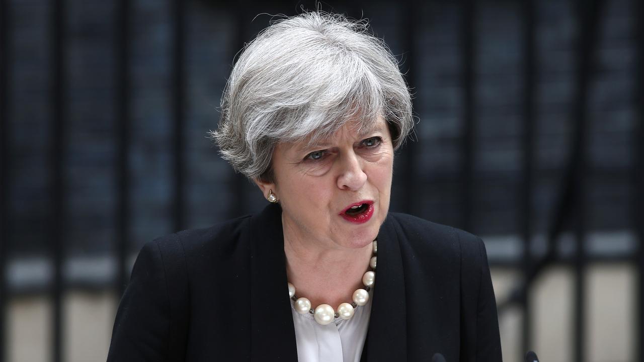Theresa May lors de son allocution au lendemain de l'attentat, devant le 10 Downing Street. [Reuters - Neil Hall]