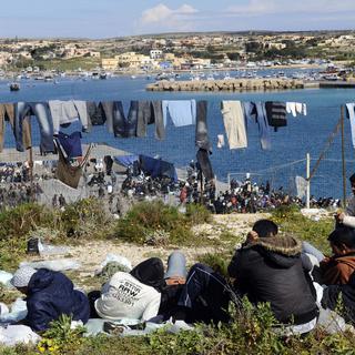 Des migrants sur l'île de Lampedusa. [AP/Keystone - Giuseppe Giglia]