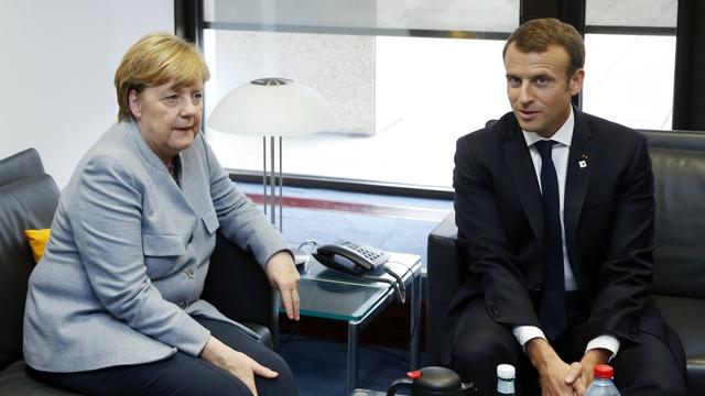 Angela Merkel et Emmanuel Macron jeudi à Bruxelles. [Pool/EPA/Keystone - François Lenoir]
