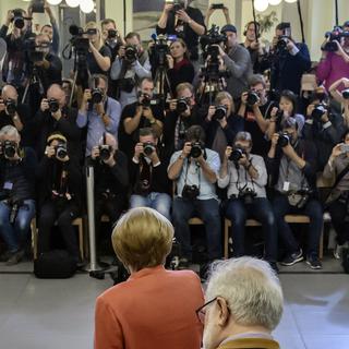 La chancelière Angela Merkel, candidate à un quatrième mandat, a voté à Berlin. [Keystone - EPA/CLEMENS BILAN]