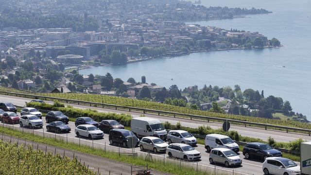 Le Conseil fédéral envisage notamment de traiter de manière différenciée les véhicules autonomes et les voitures traditionnelles sur les autoroutes. [Keystone - Cyril Zingaro]