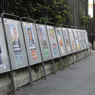 Les affiches des 11 candidats à la présidentielle française. [afp - Ludovic Marin]