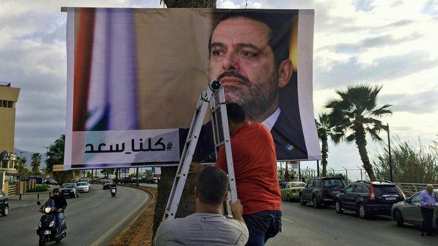 Portrait du Premier ministre démissionnaire dans une rue de Beyrouth. [AP/Keystone - Hussein Malla]