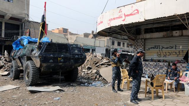 Forces de police irakiennes dans un quartier de Mossoul, 20.03.2017. [EPA/Keystone - Ahmed Jalil]