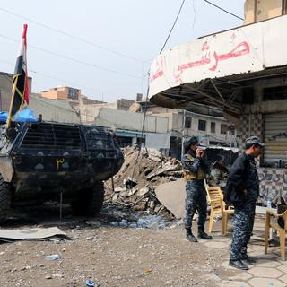 Forces de police irakiennes dans un quartier de Mossoul, 20.03.2017. [EPA/Keystone - Ahmed Jalil]