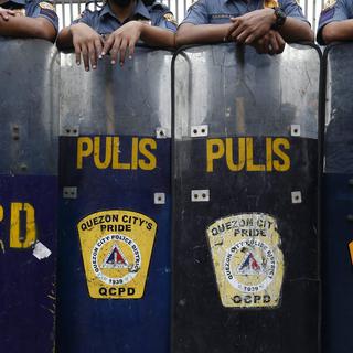 Un rapport d'Amnesty International montre du doigt les meurtres extrajudiciaires commis par la police philippines (photo d'illustration). [EPA - Rolex Dela Pena]