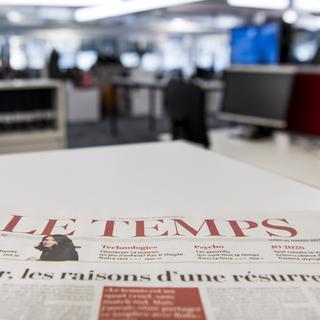 Le quotidien Le Temps se voit amputer de 36 postes. [Keystone - Jean-Christophe Bott]
