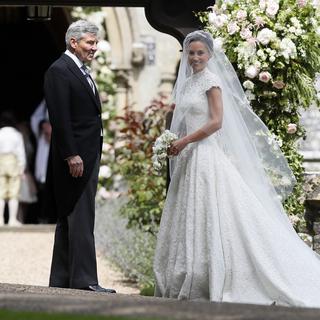 Pippa Middleton et son père. [AP Photo/Keystone - Kirsty Wigglesworth]