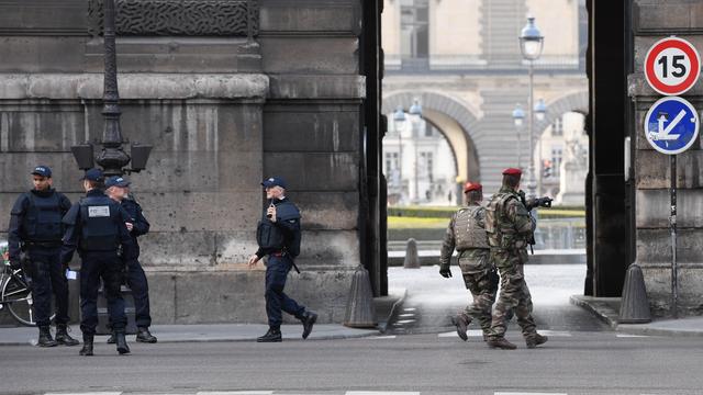 French police officers and soldiers patrol in front of the Louvre museum on February 3, 2017 in Paris after a soldier has shot and gravely injured a man who tried to attack him. "Serious public security incident under way in Paris in the Louvre area," the interior ministry tweeted on February 3 as streets in the area were cordoned off to traffic and pedestrians. 
ALAIN JOCARD / AFP [AFP]